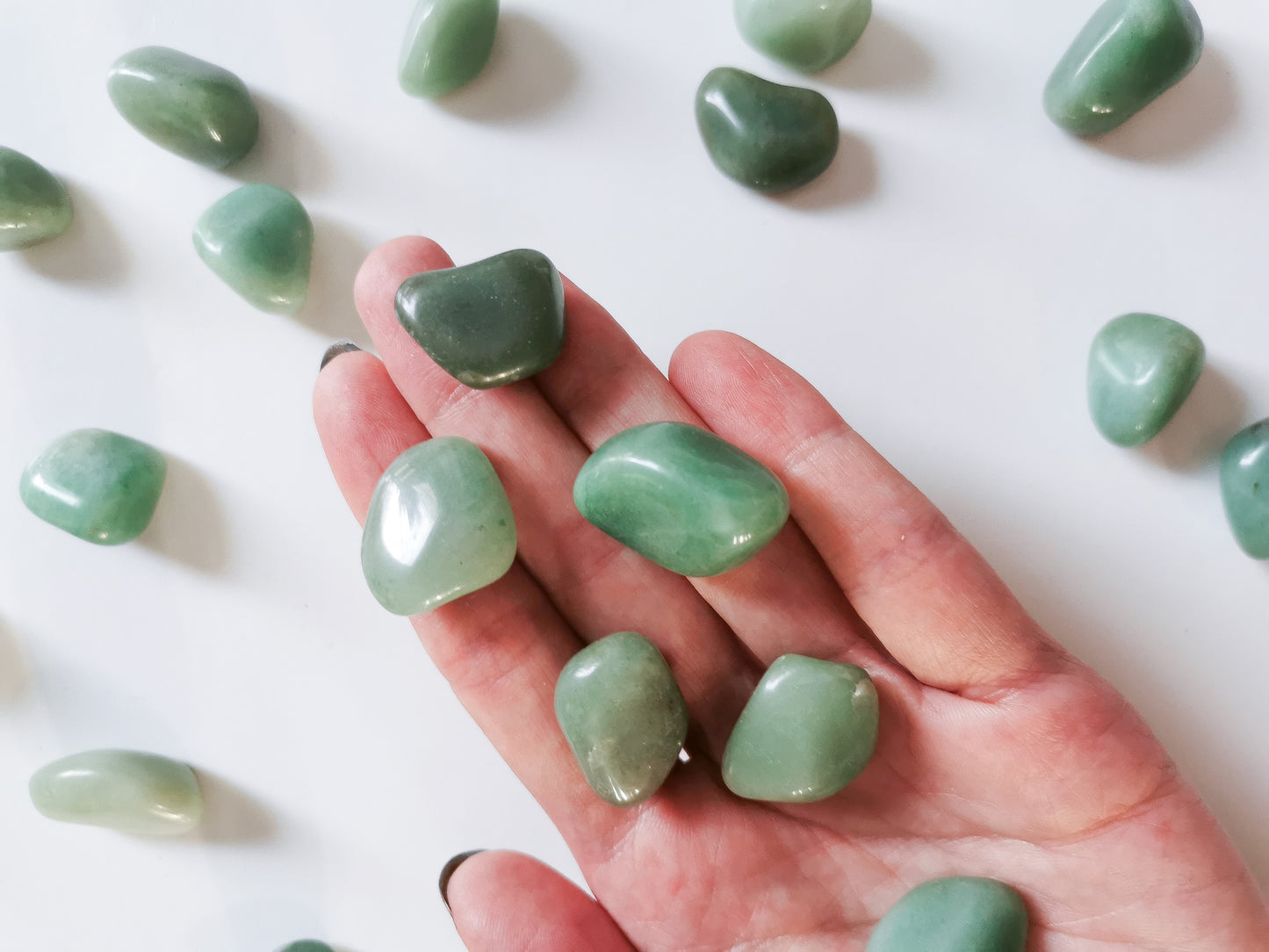 green aventurine tumble on hand