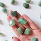 green aventurine tumble on hand